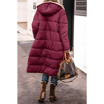 Women's green sherpa-lined insulated parka with long sleeves and a cozy collar, designed as a stylish and functional urban winter coat.