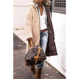Women's green sherpa-lined insulated parka, featuring long sleeves and a cozy design suitable for urban winter fashion.