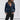 A stylish dark blue women's suede moto jacket, featuring a structured shoulder and collar design, long sleeves, and a fitted waist, perfect for trendy spring fashion.