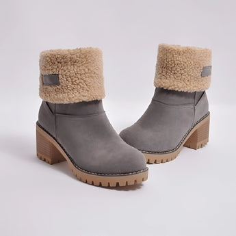 Women's green suede shearling block heel ankle boots with a natural material finish, featuring a beige fur lining and a stylish design.