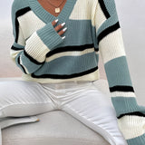 Women's green V-neck off-shoulder striped knit sweater with long sleeves, featuring a stylish and relaxed fit.