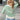 
A women's green and white striped boat neck sweater with long sleeves, perfect for casual spring fashion.