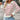 Women's green and white striped boat neck sweater, featuring long sleeves and a casual fit, perfect for spring fashion.