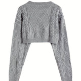 Women's grey cropped cable knit wool sweater featuring a stylish design with a high neck and long sleeves, showcasing winter fashion.