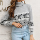 Women's gray cropped turtleneck Aztec sweater, featuring a modern knitwear style. The sweater is displayed with attention to its unique pattern and design details.