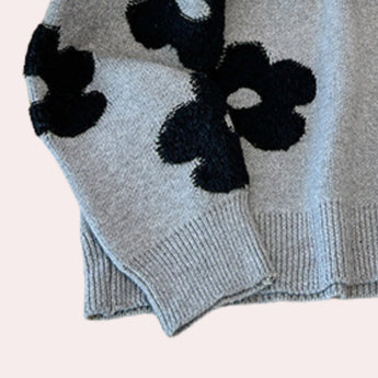 Women's grey floral sweater with a cozy crew neck design, featuring long sleeves and a knit woolen texture suitable for winter wear.