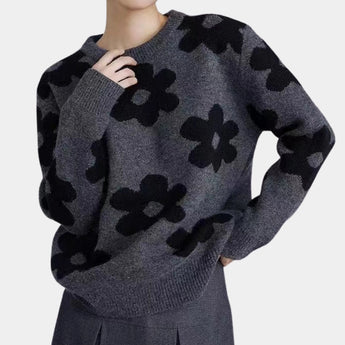 
A dark gray women's floral sweater in XL, featuring a cozy crew neck and long sleeves, ideal for winter wear.