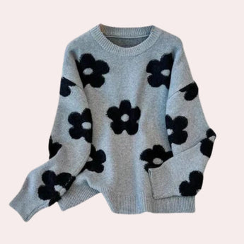 Women's grey floral sweater with a cozy crew neck design, featuring long sleeves and a subtle floral pattern, ideal for winter wear.
