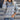 Women's grey plaid fleece sweater featuring a cozy high neck pullover design, displayed in a photograph. The sweater is in a gray color, size XL, with long sleeves and a comfortable fit around the waist. The textile has a soft, warm appearance suitable for chilly weather.