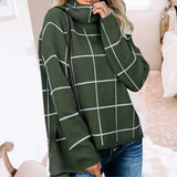 Women's grey plaid fleece sweater with high neck pullover design, featuring a tartan pattern. The sweater is styled with long sleeves and appears to be paired with jeans.