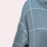 Women's grey plaid fleece sweater with high neck pullover design, featuring long sleeves and a cozy, patterned fabric.