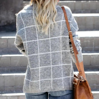 Women's grey plaid fleece sweater with a cozy high neck pullover design, featuring long sleeves and a tartan pattern.