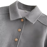 Women's grey wool blend cropped jacket featuring a button front, long sleeves, and a collar. The jacket has a blazer-style design, suitable for stylish winter outerwear and formal wear occasions.