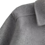 
A stylish women's grey wool blend cropped button jacket featuring a structured collar and long sleeves, designed for winter wear. The jacket is paired with denim, showcasing a modern and chic ensemble.