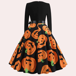 Women's Halloween party dress featuring a pumpkin print design with an A-line swing silhouette, showcasing a round neckline and long sleeves. The dress is in shades of brown and peach, suitable for formal events or festive occasions.