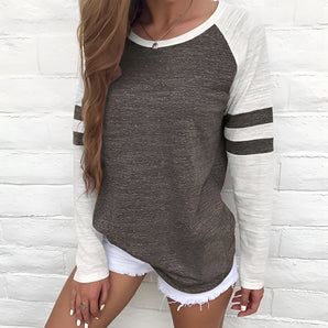 Women's heather grey raglan tee with black and white striped sleeves, featuring a crew neck design in a casual style, size 2XL.