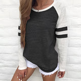 Women's heather grey raglan tee featuring black and white striped sleeves, shown in Nero color variant, size 2XL.