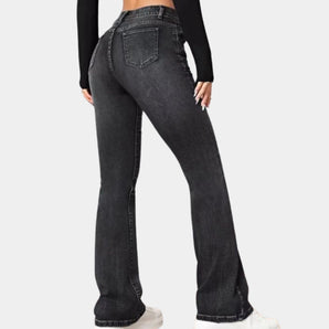 Women's high-waist flared black jeans made of slim fit stretch denim, highlighting the waist and thighs.