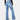 Women's high-waist flared black jeans made of slim fit stretch denim, showcasing the waistline and flared cut with emphasis on the thigh and knee areas.