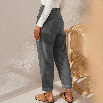 Women's high-waisted terracotta corduroy cropped pants featuring a tailored fit, showcasing the waist and ending at the knee, with a stylish, textured design suitable for both casual and formal wear.