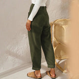 High-waisted terracotta corduroy cropped pants for women shown on a model, highlighting the waist and thigh areas.