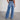 Women's vintage style high-waisted wide-leg jeans in blue, featuring a frayed hem detail.