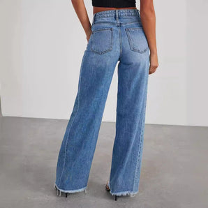 Women's vintage style high-waisted wide-leg jeans in blue, featuring a frayed hem detail.
