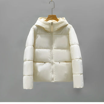 Women's hooded color block insulated puffer jacket with long sleeves and a stylish design, featuring a high collar for added warmth and protection against the cold.
