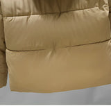 Women's hooded color block insulated puffer jacket featuring a beige and khaki color scheme, with a comfortable fit, long sleeves, and a fur-lined collar.