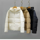 Women's hooded color block puffer jacket with insulated material, features long sleeves and a stylish, symmetrical color block pattern.