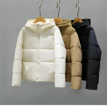 Women's hooded color block puffer jacket with insulated material, features long sleeves and a stylish, symmetrical color block pattern.