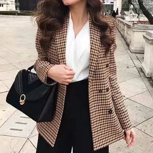 Women's houndstooth double-breasted blazer in black and white pattern, featuring a classic tartan design.