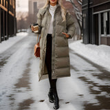 
A women's insulated hooded long down winter coat in white, featuring long sleeves and designed for cold weather fashion.