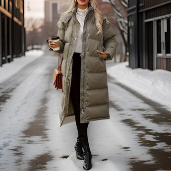 
A women's insulated hooded long down winter coat in white, featuring long sleeves and designed for cold weather fashion.