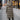 Women's insulated hooded long down winter coat with fur-trimmed hood, featuring long sleeves and a fitted waist, suitable for freezing winter conditions.