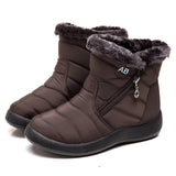 Black winter snow boots for women with insulation and waterproof features, lined with fur for added warmth.