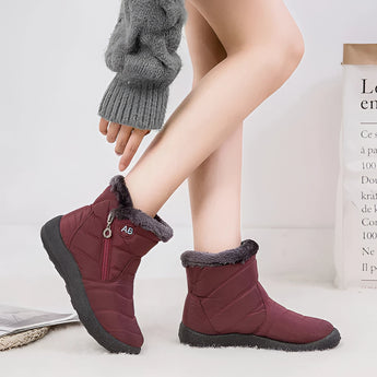 Black insulated waterproof winter boots for women with a fur lining, shown in a stylish design. The boots feature a durable sole suitable for snowy conditions.