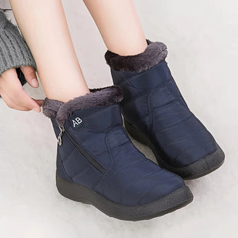 
A pair of women's insulated waterproof black winter snow boots with fur lining, styled in an electric blue color, displayed against a plain background.