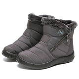Women's insulated waterproof black winter snow boots with fur lining, made with synthetic rubber material, designed for outdoor use and protection against snow and cold weather.
