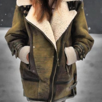 
A green women's insulated winter parka in size 5XL, featuring a faux fur hood and designed to be warm and waterproof. The parka has a structured shoulder, long sleeves, and extends down to cover the waist, resembling an overcoat or trench coat style.