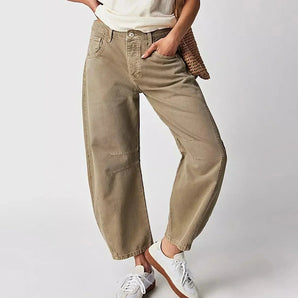 Women's khaki high-waisted cargo pants in beige, featuring multiple pockets, demonstrating a sustainable streetwear style.