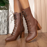 Brown women's lace-up leather ankle boots with a 7.5cm heel, showcasing a stylish and fashionable design suitable for various occasions.