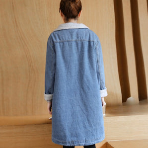 Women's light blue denim overshirt with fleece lining, featuring a loose fit, long sleeves, and a classic collar.
