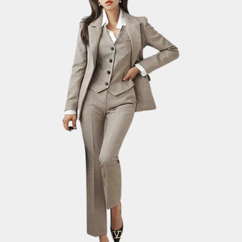 Women's light gray tailored vest suit consisting of a fitted vest, matching trousers, and a coat. The suit is designed for office wear, featuring a classic collar, structured shoulders, and long sleeves. The fabric has a subtle khaki undertone, suitable for a sophisticated, professional look.