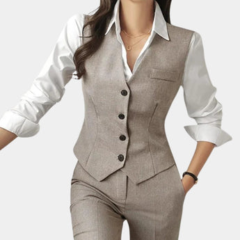 Women's light gray 3-piece tailored vest suit, featuring a sleek design with a dress shirt, coat, and vest. Perfect for elegant office wear, highlighting elements like the collar, sleeves, and waist.