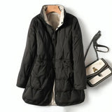 Stylish women's lightweight black hooded puff jacket with long sleeves and a water-resistant finish, designed for a sleek and fashionable look.
