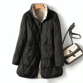 Stylish women's lightweight black hooded puff jacket with long sleeves and a water-resistant finish, designed for a sleek and fashionable look.