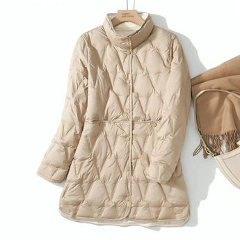 Women's lightweight khaki hooded puff jacket in 3XL with a stylish design, featuring long sleeves and a collar. The jacket has a water-resistant fabric ideal for versatile and fashionable outdoor wear.