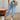 
A pair of women's lightweight denim jeans in washed blue, featuring a relaxed fit with a cropped length, displayed against a plain background. The focus is on the waist, thigh, and knee areas, highlighting the fabric's texture and stitching details.
