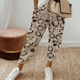 Lightweight relaxed fit lilac floral joggers for women in beige color, size 3XL, with a focus on the waist and thigh areas, suitable for active wear.